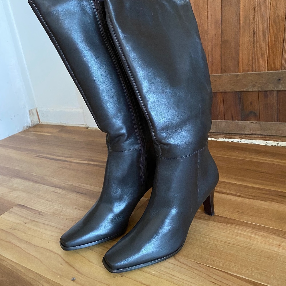 Leather high boots with square toes and side zipper.  .